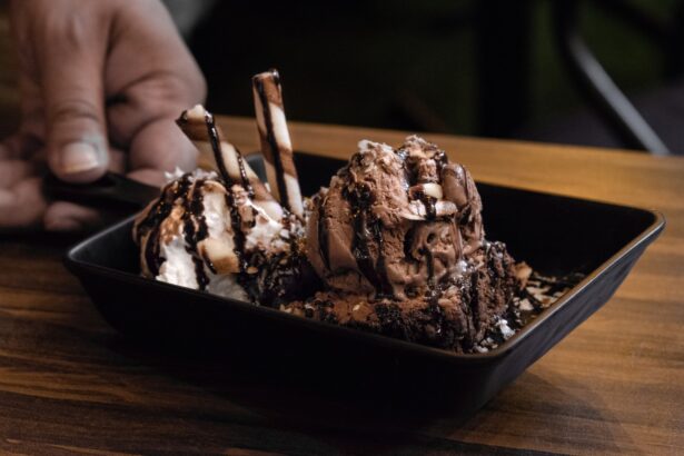 Chocolate ice cream on a brownie in a square dish